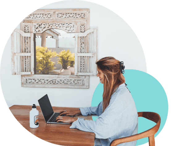 Woman working on a laptop at a desk